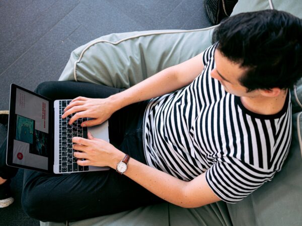 photo of man using laptop